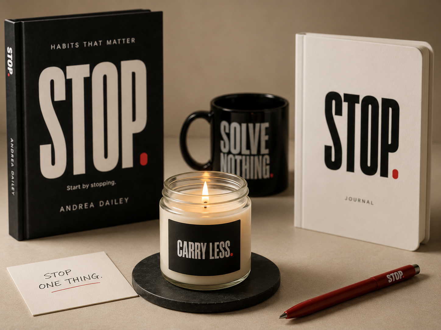 STOP book, STOP journal, mug, candle, note card, and pen on a neutral surface.